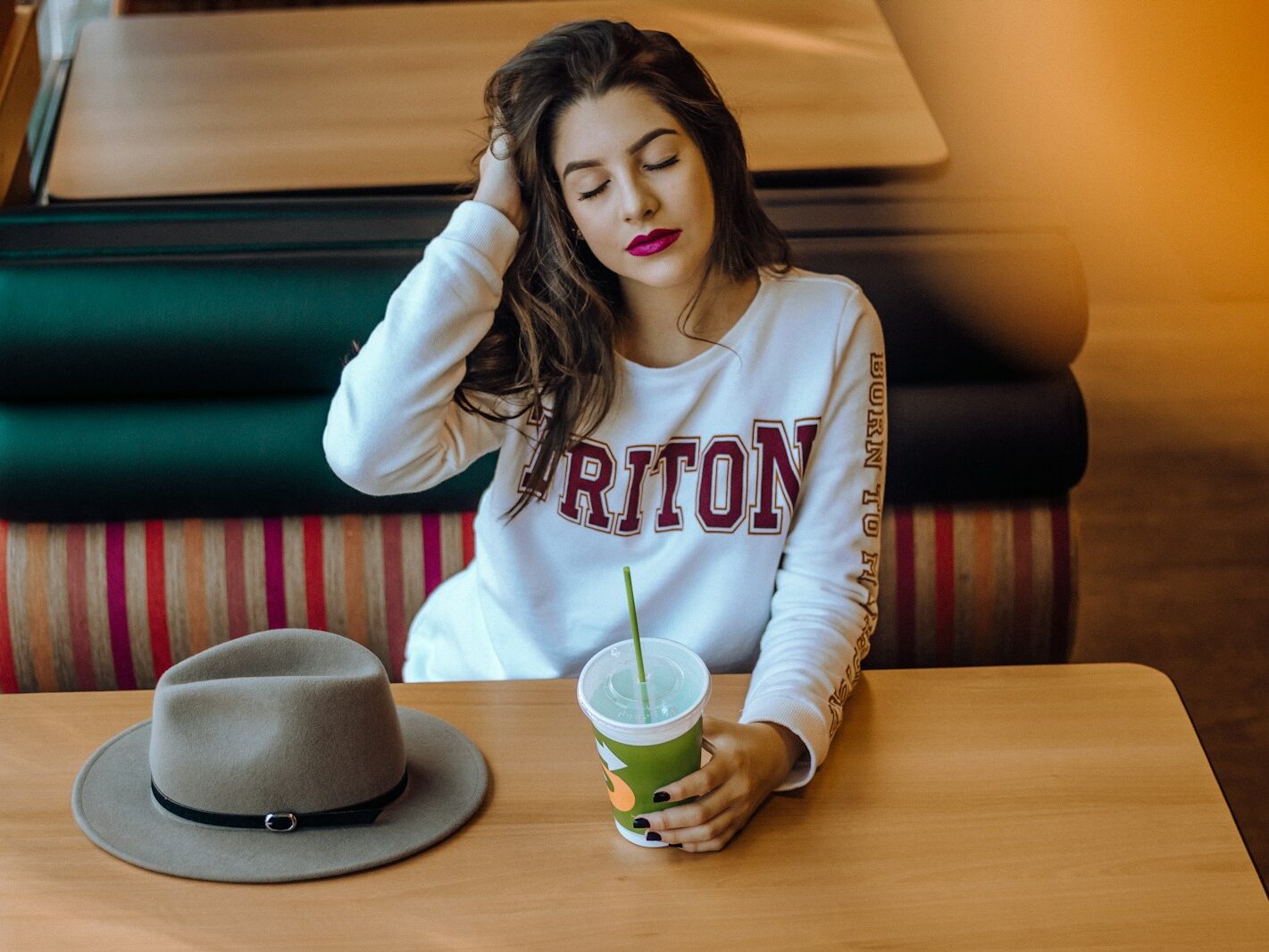 woman sitting on chair near table