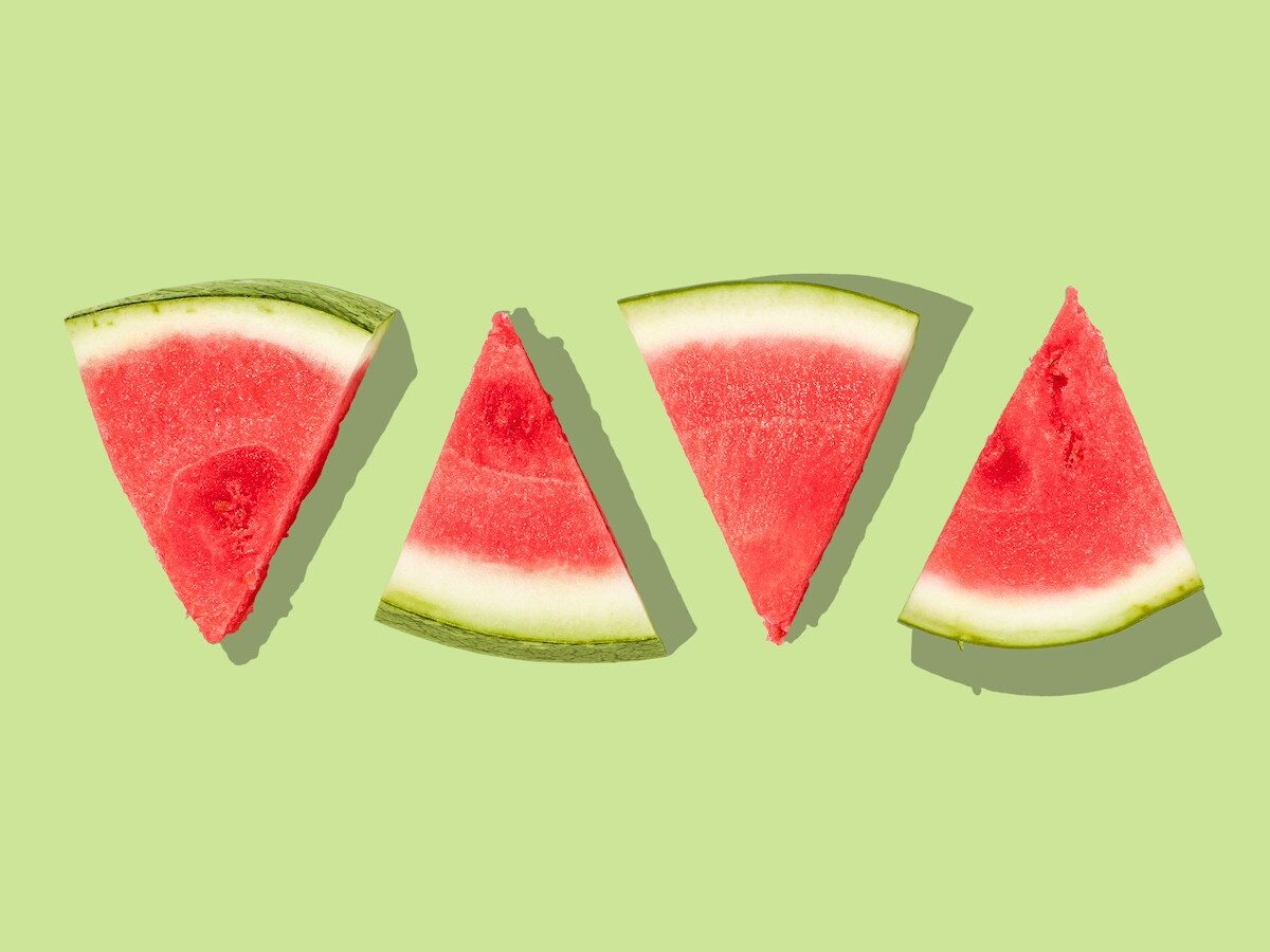 sliced watermelon with green background