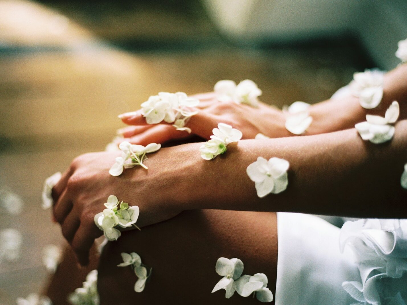 person surrounded by white flowers