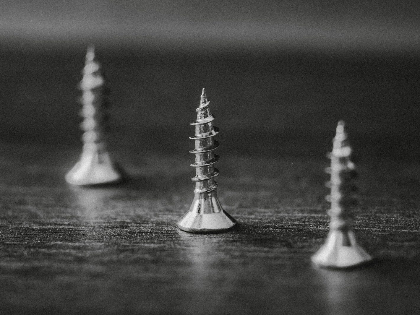 silver chess piece on black table