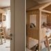 Wooden loft bunk bed shaped like a small house with a ladder, string lights, and a cozy seating area underneath in a bright kids’ room.