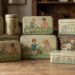 Stack of vintage tin lunch boxes with illustrated children and animals on a wooden table.